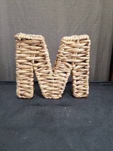 lot 1552 image: Woven Water Hyacinth Letter M Wall Decor