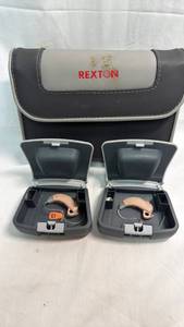 lot 9 image: Rexton BTE Hearing Aid Pair with Cases and Accessories