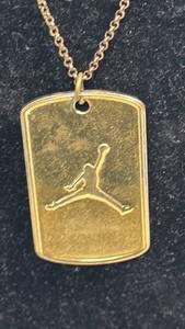 lot 87 image: Air Jordan VI Jumpman Dog Tag Necklace - June 12, 1991 Championship Commemorative