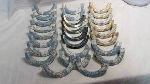 lot 114 image: Lot of Decorative Crescent-Shaped Drawer Pulls with Floral Pattern