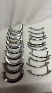 lot 119 image: Lot of 21 Chrome Mid-Century Drawer Pulls - Semi-Circle and Bow Style
