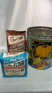 lot 212 image: Butterfly Brand Golden Pumpkin Decorative Tin with Bobs Red Mill Flour Bundle
