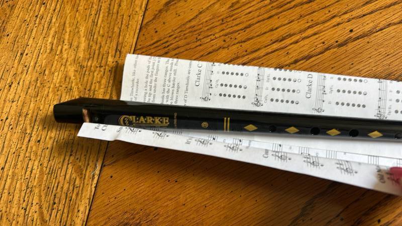 lot 863 image: Clark Tin Whistle with Music Sheets