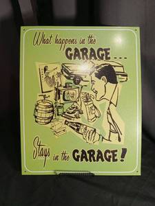 lot 5522 image: What Happens in the Garage Stays in the Garage Metal Sign