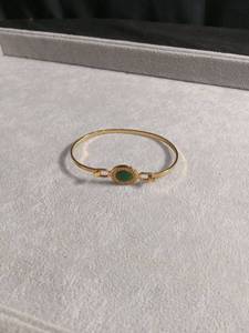 lot 50396 image: Gold-Tone Bangle Bracelet with Green Cabochon Stone