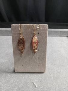 lot 50418 image: Gold-Tone Dangle Earrings with Oval Patterned Beads