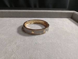 lot 50420 image: Gold-Tone Glitter Bangle Bracelet with Screw Motif