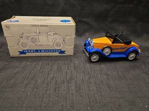 lot 50802 image: Spec Cast Liberty Classics Butterfinger Ford Model A Roadster 125 Scale Die Cast Coin Bank