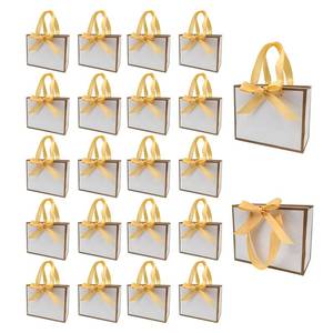 lot 11822 image: TKSBAG 100 Pack White and Gold Gift Bags with Bow Handles, 6.43.15.1 In Small Thank You Bags Bulk for Birthday, Weddings, Party Favors, Fathersft Day