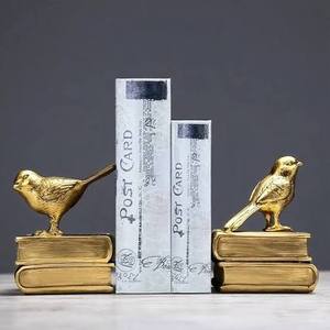 lot 11826 image: RAZ Imports Bird on Bookends, 5.5-Inch, Resin, Antique Gold, Set of 2