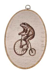 lot 6219 image: Embroidered Frog on Penny Farthing Bicycle Oval Hoop Wall Art