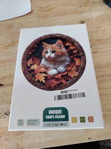 lot 2459 image: Unique shape jigsaw puzzle cat portrait white orange cat factory sealed