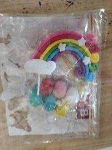 lot 2413 image: Squishy Pop It Rainbow Cake Topper Set