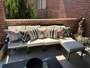 lot 951 image: L-Shaped outdoor sofa with cushions and accent pillows
