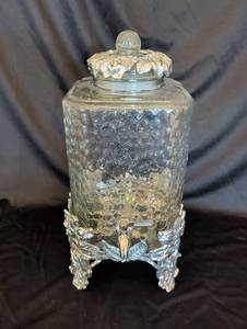 lot 1115 image: Glass Beverage Dispenser with Ornate Silver-Tone Floral Metal Stand