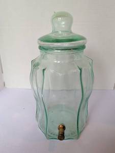 lot 1129 image: Green Glass Beverage Dispenser Jar with Brass Spigot and Lid. 15 inches tall