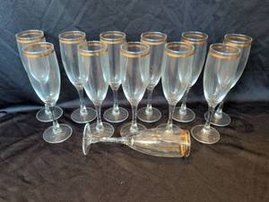 lot 1209 image: Set of 12 Gold Rim Champagne Flutes. Matches lot 1210