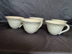 lot 1228 image: Set of 5 White Embossed Swirl Porcelain Tea Cups