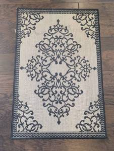 lot 1292 image: Black and Cream Medallion Accent Rug 24x36 in
