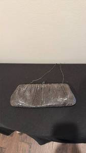 lot 1308 image: Santi clutch bag