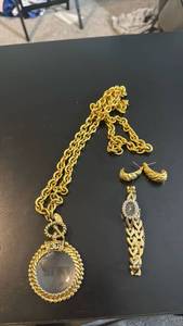 lot 1968 image: Chanel gold-plated loupe necklace, earrings and watch