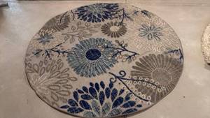 lot 2003 image: Safavich Cabana rug approx 6 ft dia great condition located in basement