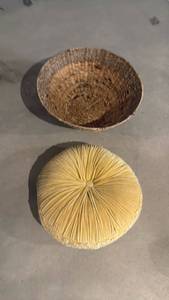 lot 2012 image: Basket 9x19 dia with pillow located in basement