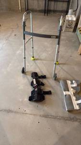 lot 2017 image: Drive collapsible walker and 2 leg supports located in basement