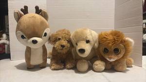 lot 3543 image: Lot of 4 Stuffed Animal Plush Toys - Reindeer, Dog, Puppy, and Lion