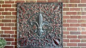 lot 4005 image: Tin outdoor decor 3 ft x 3 ft must be removed from brick wall