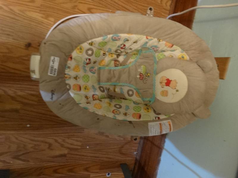 lot 6806 image: Winnie the pooh baby bouncer.