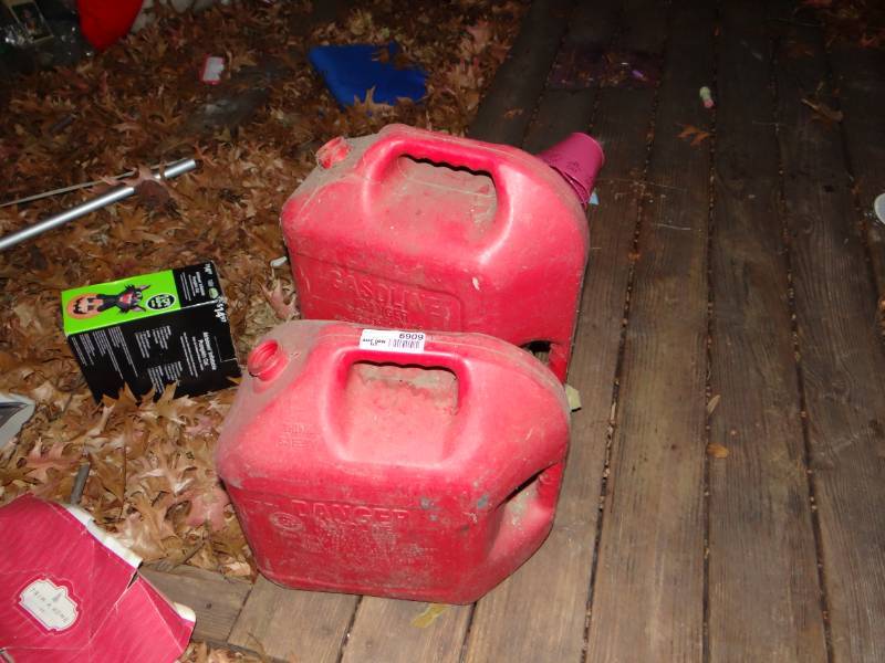 lot 6909 image: 2 Gas cans 6 & 5 gal.