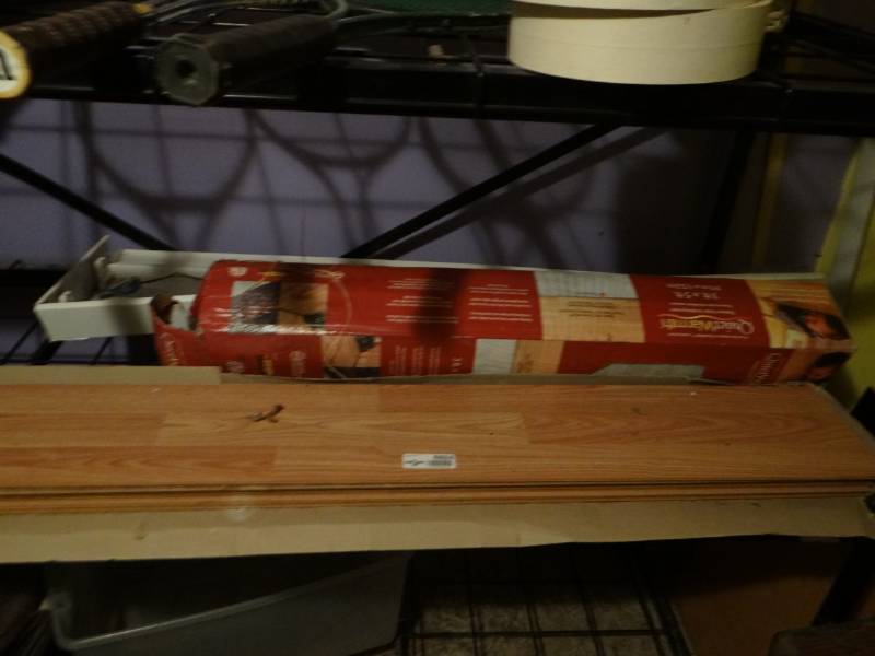 lot 6924 image: Heated floor, balance light fixture and laminate flooring.
