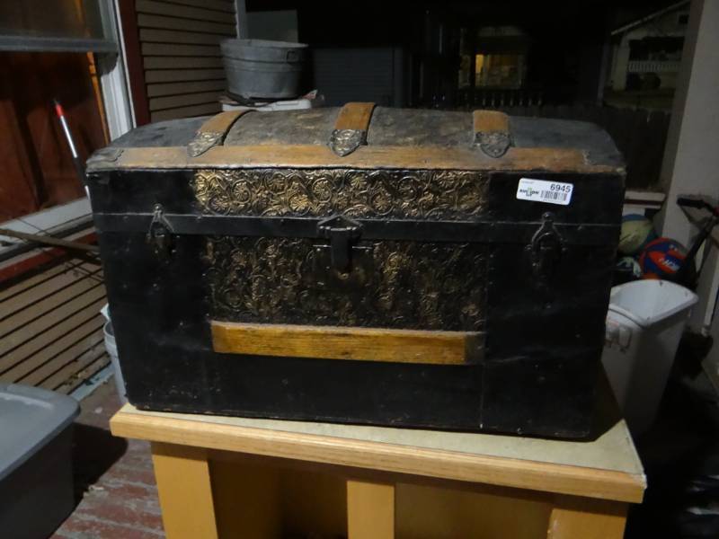 lot 6945 image: Small to medium vintage humpback trunk.