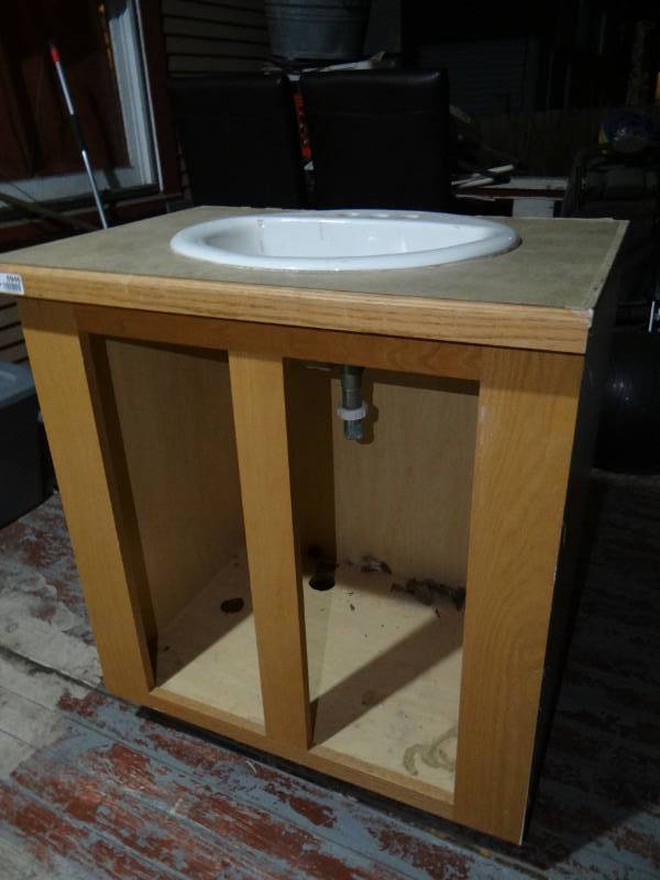lot 6946 image: Bathroom cabinet with sink no doors.