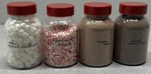 lot 6511 image: 4-Piece Jar Set Mini Marshmallow Peppermint Cocoa Dark Cocoa with Red Caps (Sizes Unknown)
