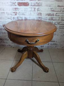 lot 513 image: Oak Oval Drum Table with Claw Feet and Drawer - 22in &amp 27in diameter x 23 H in