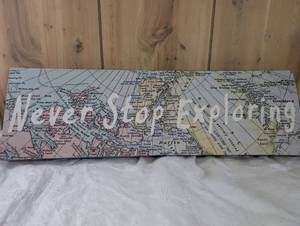 lot 1501 image: Never Stop Exploring Map Canvas Wall Art