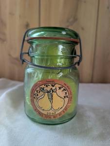 lot 2510 image: Country Life Soap Company Green Glass Canning Jar with Pear Soap Shapes