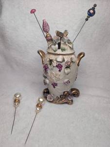 lot 3011 image: Vintage Porcelain Floral Hat Pin Holder with Hat Pins Collection