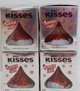 lot 7307 image: Hersheys Kisses Santa Hat Solid Milk Chocolate 4-Pack 1.44 oz 426