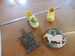 lot 4142 image: Trivets and Mismatched shoe planters