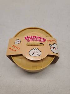 lot 58476 image: Mystery Dumpling Squishy Toy by PLMAN - Retail $8