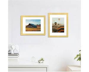 lot 58482 image: Picture Frame Set of 4, High Definition Real Glass, Display Pictures 8x10 with Mat or 11x14 Without Mat, Gallery Wall Hanging Photo Frames, Gold. ONE OPENED AND HAS SCRATCHES ON THE FRAME. - Retail $34