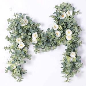 lot 842 image: PARTY JOY 6.56ft Eucalyptus Garland with Flowers-8 White Roses, Artificial Fake Flowers Greenery Garland Floral Vines for Decoration Party Wedding Table Indoor Outdoor Backdrop Wall Decor(White) - Retail $23