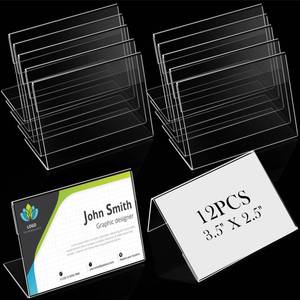 lot 495 image: Teling 12 Pcs 3.5 x 2.5 Inch Acrylic Business Card Holder Slant Back Sign Holders Clear Name Display Mini Acrylic Stands l Shaped Display Stand for Classroom Home Office Decorating Supplies - Retail $10