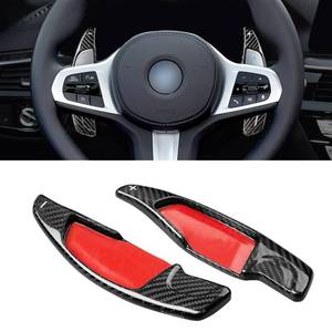 lot 2562 image: Real Carbon Fiber Paddle Shifter Extension Cover Compatible with BMW 2 3 4 5 6GT 7 8 Series G01 G38,X3 X4 X5 X6 X7 M5 M8 X3M X4M X5M X6M XM Z4 2016-2026Steering Wheel Paddle Shifter, Black - Retail $57