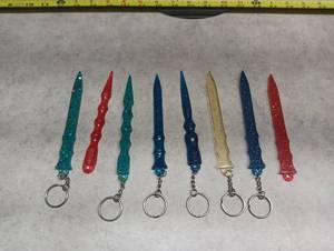 lot 308 image: Handmade Resin Glitter Dagger Sword Keychain Set of 8