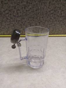 lot 359 image: Clear Plastic Beer Mug with Bicycle Bell Handle