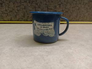 lot 374 image: Oklahoma Or Bust Blue Enamel Speckled Camp Mug